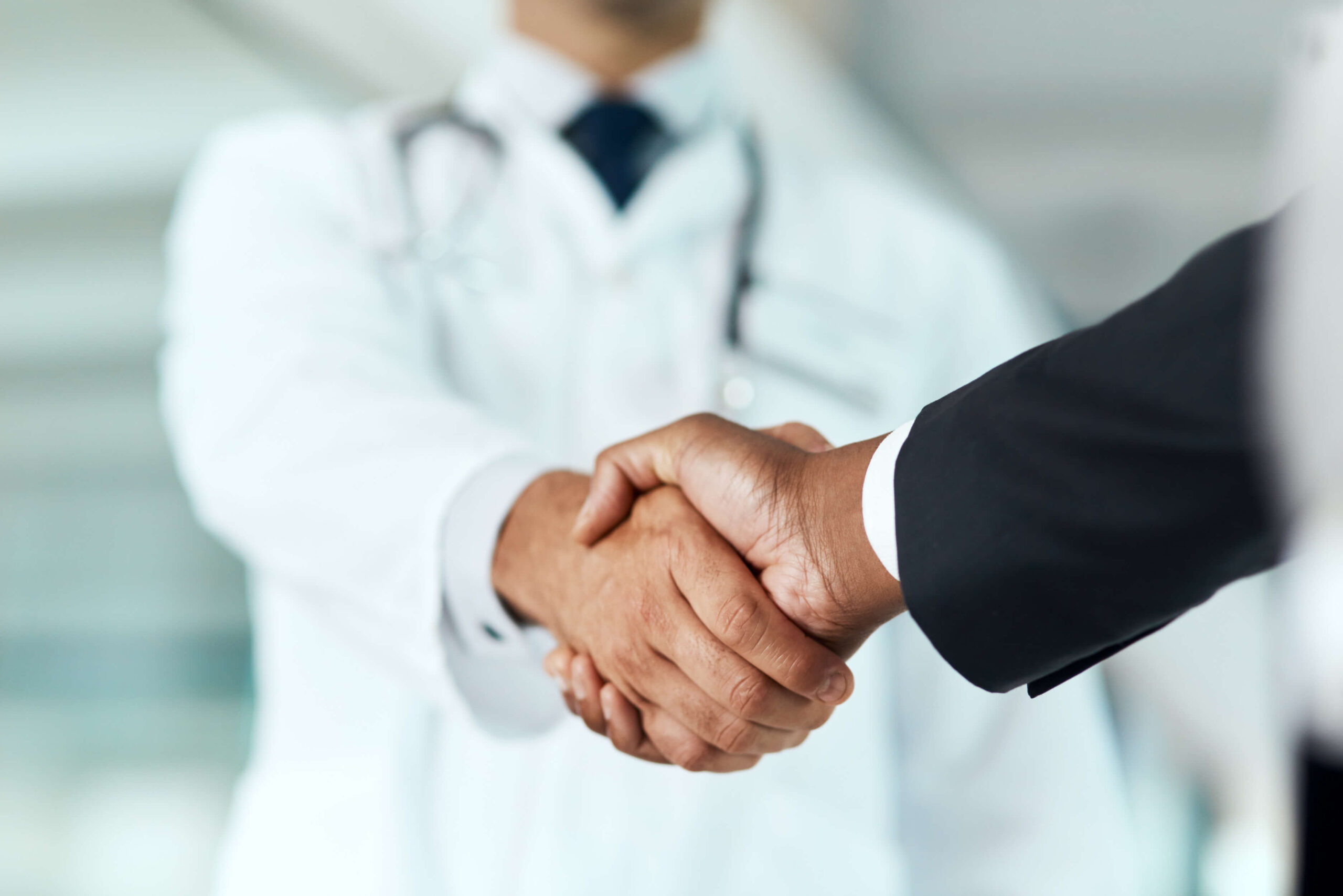 closeup-doctor-man-with-handshake-negotiation-planning-with-partnership-healthcare-wellness-medical-professional-consultant-employee-with-offer-support-teamwork-with-promotion